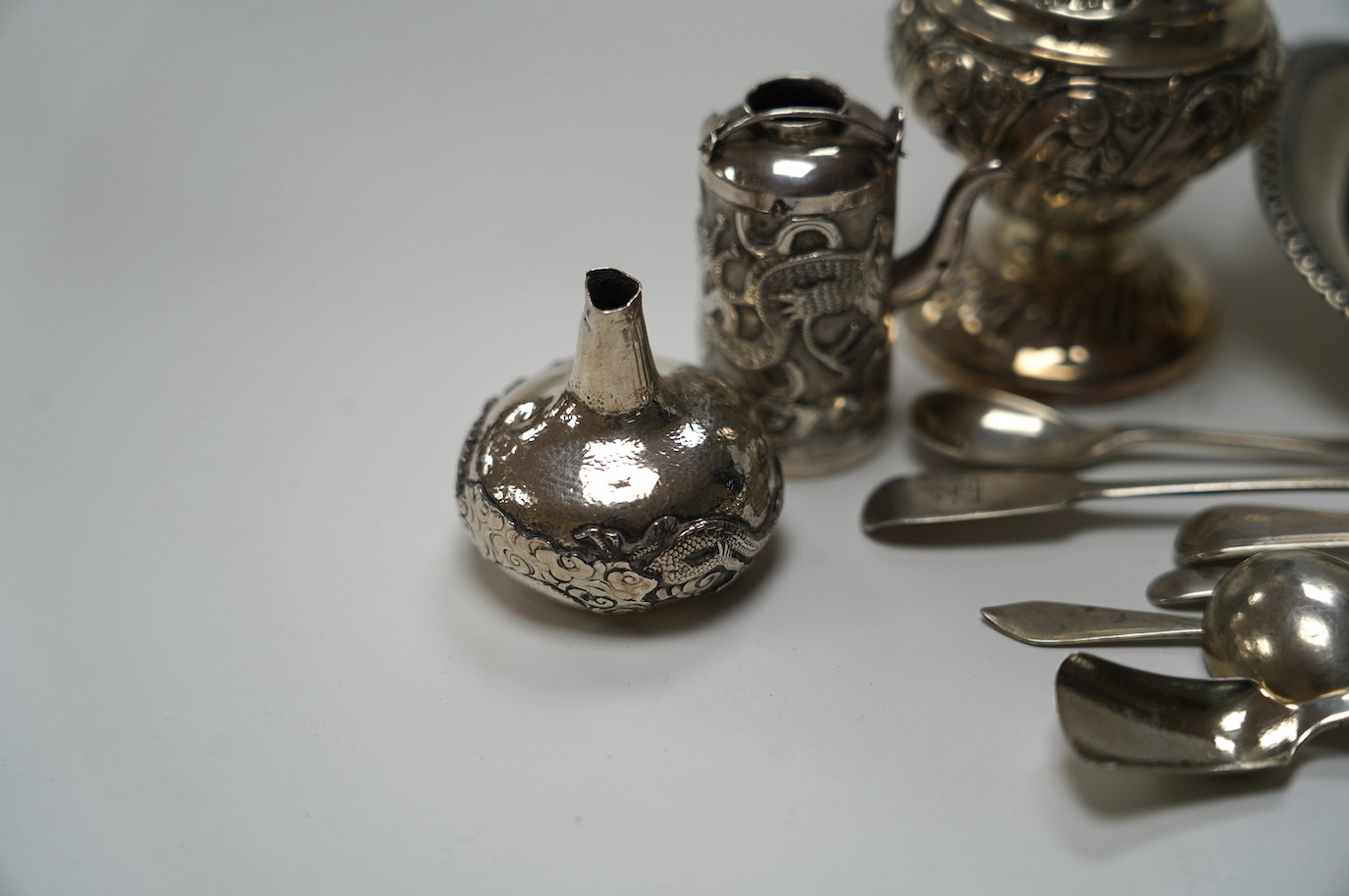 A George III silver snuffers stand, London, 1810, 22.8cm, together with sundry silver flatware, a silver sugar caster, a miniature Chinese white metal tea kettle by Wang Hing, lacking cover and one other item. Condition